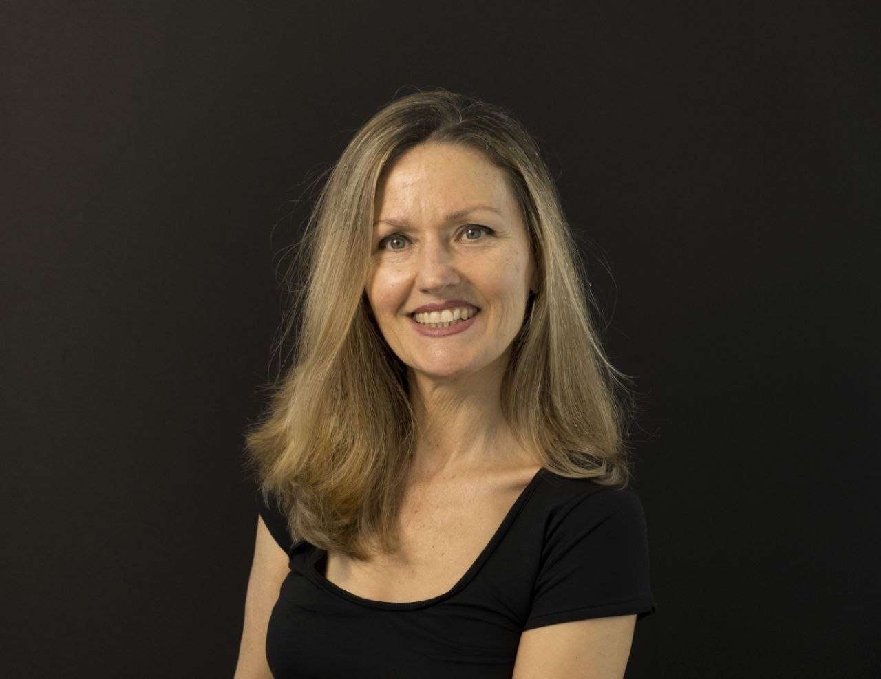 professional portrait photo of Marsha Morris - health coach and business owner of Natural Restorative Nutrition