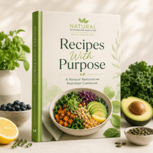 Natural Restorative Nutrition cookbook titled Recipes With Purpose displayed with fresh healthy foods, including avocado, greens, blueberries, lemon, and seeds.